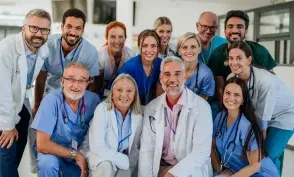 Portrait of happy doctors, nurses and other medical staff in a hospital.